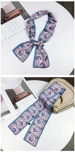 Detailed view of animal print pink silk scarf tied as a stylish fashion bag accessory