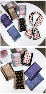 Close-up of elegant double-sided heart pattern silk scarves in multiple colors