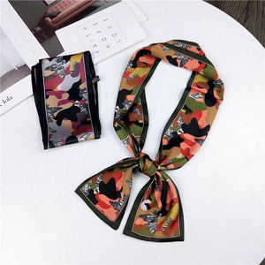 Detail view of camouflage twilly scarf with abstract patterns and 100% polyester fabric