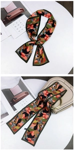 Detail of camouflage twilly scarf tied as a decorative strap on a beige handbag handle