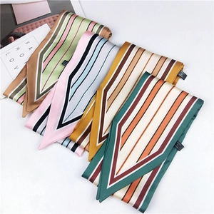 Detailed close-up of striped satin scarves in multiple colors with 100% polyester wash label