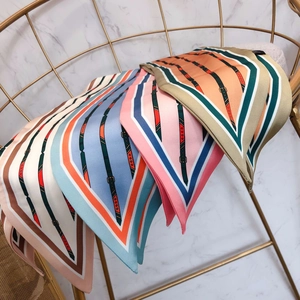 Silk-feel scarves with equestrian print and metal buckle patterns in four colors