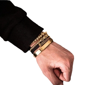 Retro titanium steel bracelet set for men featuring gold bangles and black woven wristbands