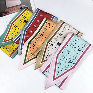 Five assorted polka dot silk scarves featuring playful puppy prints on white background