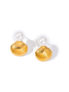 Detailed view of gold shell earrings with white pearls featuring fine radial texture