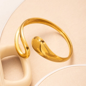 Elegant gold-plated minimalist open cuff bracelet with polished teardrop-shaped design