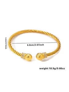 Detailed view of gold twisted cable bracelet showing 6.8cm diameter and zircon spheres