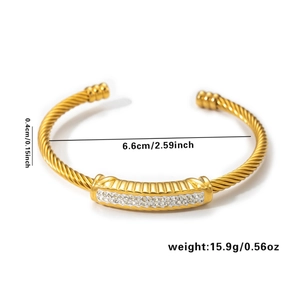 Gold braided open cuff bracelet with zircon inlay and product size specifications