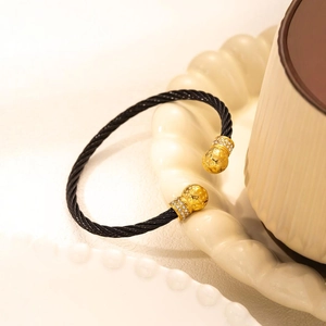 Gold cable wire open bangle with hammer-textured spheres and sparkling cubic zirconia