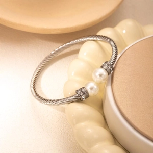 Elegant silver cable cuff bracelet with two pearls and sparkling zircon accents