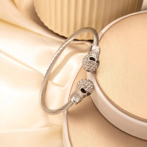 Punk style skull cable wire open bangle with sparkling pavé crystals in silver finish