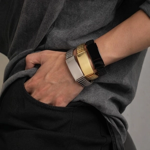 Men stainless steel ID bracelets in silver, gold, and black colors on a male wrist