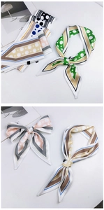 Close-up of assorted polka dot silk scarves styled for neck, hair and bags