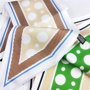Polka dot silk scarf in green and brown polyester fabric with diagonal twill texture
