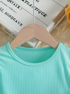 Mint green ribbed cotton dress for girls featuring a round neck and long sleeves
