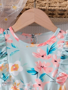 Floral print summer girl dress in light mint green with ruffle sleeves and sweet design