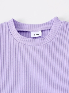 Close-up of purple ribbed knit infant top neckline showing quality fabric and 6-9M size label