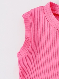 Detail of pink ribbed knit sleeveless top showing crew neck and stitching textures