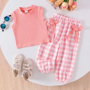 Girl's pink ribbed tank top and checkered pants set with bow details and sunglasses