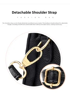 Détails des boucles dorées réglables et texture de cuir sur sac à main noir tendance