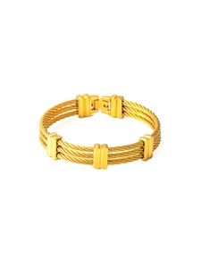 Macro detail of triple cable 18K gold-plated stainless steel bracelet with fold-over clasp