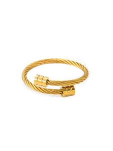 Detailed macro view of 18k gold plated stainless steel cable twist texture on cuff bracelet