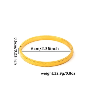 Detailed view of gold 18K plated bangle with geometric facets and size specifications