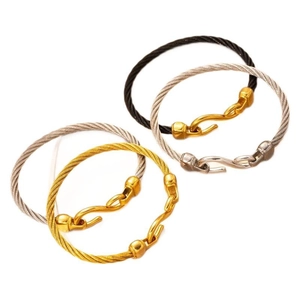 Minimalist cable wire bangles in gold, black, and silver finishes with hook clasps