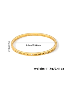Detail of 18k gold plated bangle with Roman numerals, 6.5cm diameter and zircon inlay
