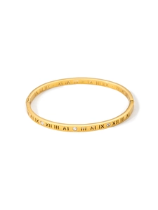 Detailed macro view of 18k gold plated bangle with Roman numerals and inlaid crystals