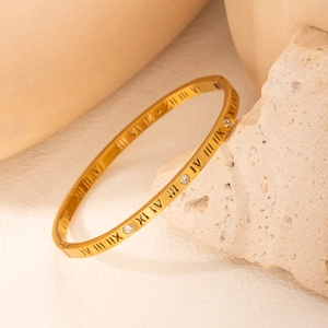 18k gold plated stainless steel roman numeral bangle with cubic zirconia on stone base