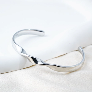 Polished silver Mobius twist cuff bracelet in minimalist 18k plated titanium steel