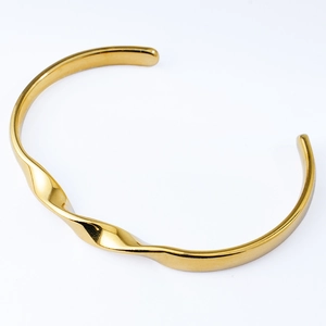 Minimalist Mobius 18k gold plated titanium steel bangle with polished wave design
