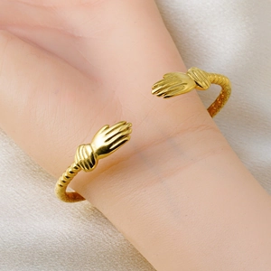 18k gold plated stainless steel hug open cuff bracelet with unique hand clasp and spiral texture