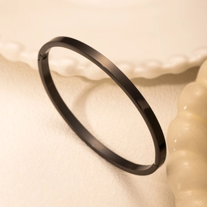 Minimalist black matte stainless steel cuff bracelet with high-quality hinged closure