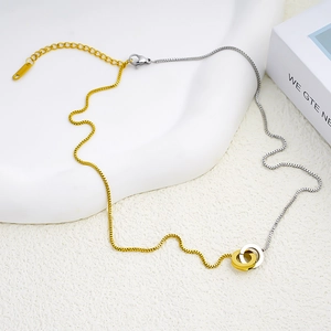 Minimalist interlocking double circle pendant necklace in two-tone gold and silver finish