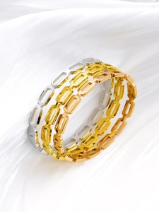 Detailed view of hollow geometric link bracelets in gold, silver, and rose gold plating