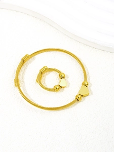 Detail of twisted cable jewelry set with gold heart charms and bead accents