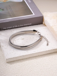 Detail of silver snake chain bracelet with lobster clasp and adjustable extension chain