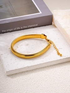 Detail of 18k gold plated stainless steel snake chain bracelet with adjustable clasp