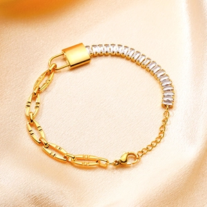 Gold stainless steel bracelet featuring rectangle cubic zirconia and a padlock pendant