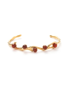 Detail of 18k gold plated stainless steel cuff with red carnelian organic textures