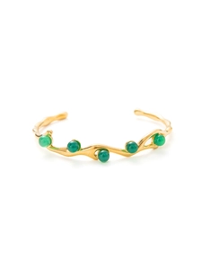 Detail of 18k gold plated stainless steel C-shape bangle with five green gemstones