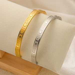 18k gold and silver stainless steel celestial bangles with sun and moon engravings