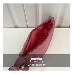 Detail view showing the spacious internal structure and matching liner of the pink nylon bag