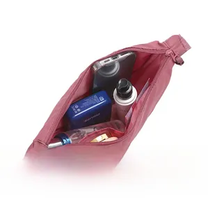 Top view of pink nylon dumpling bag open interior with zipper pocket and ample storage space