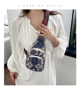 Detailed view of the ethnic crossbody chest bag with wide geometric jacquard strap