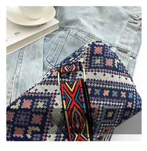 Detailed close-up of bohemian woven fabric and premium gold metal strap adjustment buckle
