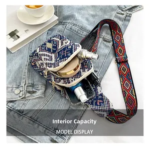 Ethnic bohemian sling bag interior capacity showing essentials on denim background
