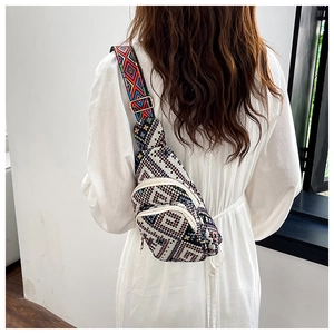 Rear view of a model wearing a geometric woven chest bag with colorful ethnic patterns